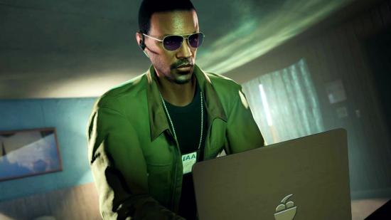Grand Theft Auto V GTA Online Criminal Enterprises update: an image of a man sat at a laptop in-game