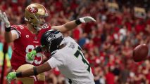 Madden 23 Ratings: Two players can be seen on the pitch with one tackling another.