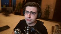 Shroud Valorant esports: Streamer shroud wearing black headphones and a black t shirt, sitting in front of a microphone