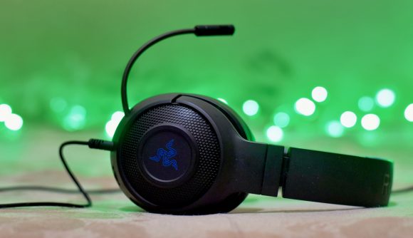 Xbox Discord voice chat: A Razer headset sat on sat with a green background behind