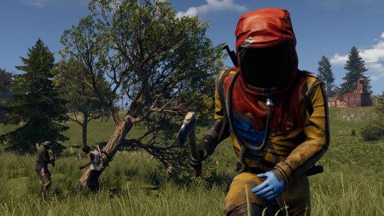 Best PS5 survival games: A man in a hazmat suit wielding an axe runs away in Rust