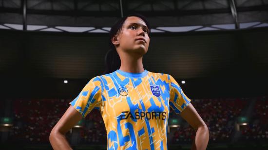 FIFA 23 pro clubs crossplay: A female player in an orange and blue kit looks up into the stands of a stadium in FIFA 23