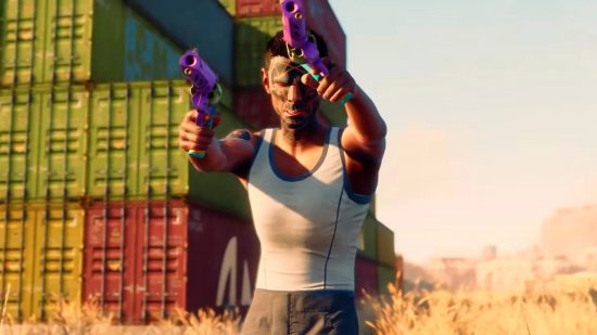 Saints Row release time: A man in a white vest aims two purple pistols with shipping containers in the background
