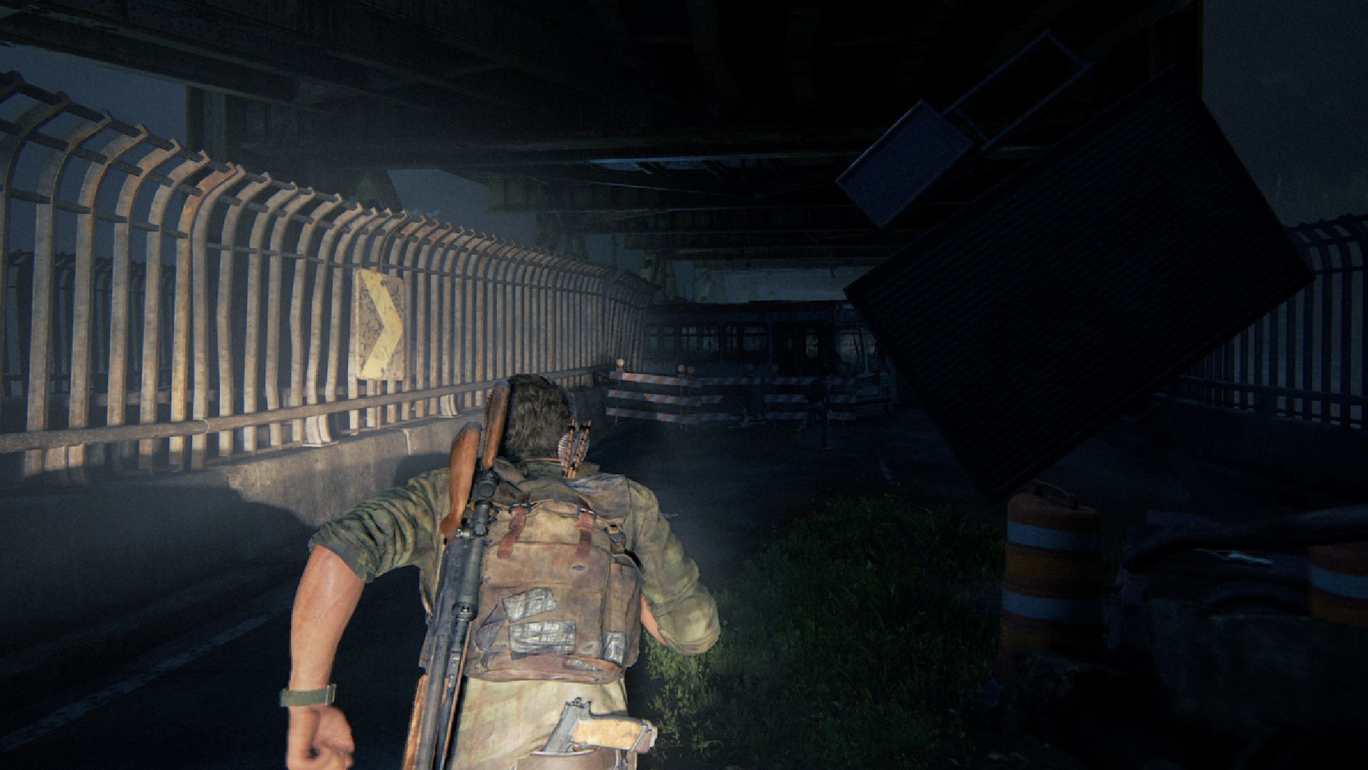 The Last of Us Part 1 Remake Review: Joel can be seen running away from the armored truck