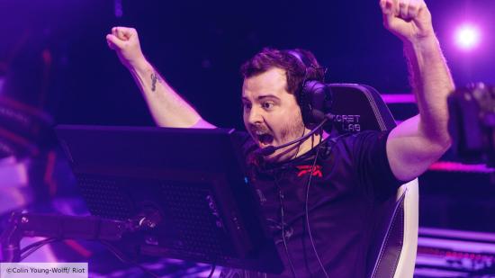 2022 Valorant Champions teams: FPX's Ange1 raises his arms and shouts in victory at a Valorant LAN event