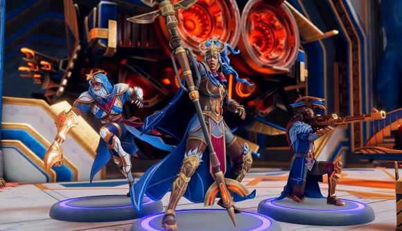 Moonbreaker console cross-play: Three figurines dressed in blue and gold armor
