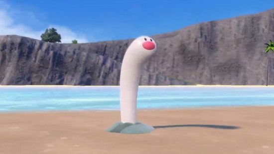 Pokemon Scarlet and Violet Wiglett: A white worm-like creature sticks up from the sand on a beach