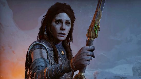 God of War Ragnarok how long to beat: A woman with a concerned expression holds a sword covered in gold decoration