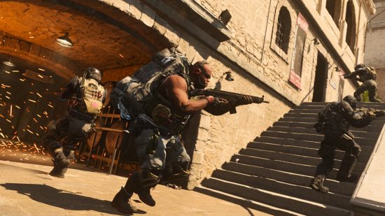 Modern Warfare 2 custom loadout locked: An operator with a rucksack of cash aims his weapon with his squad mates around him