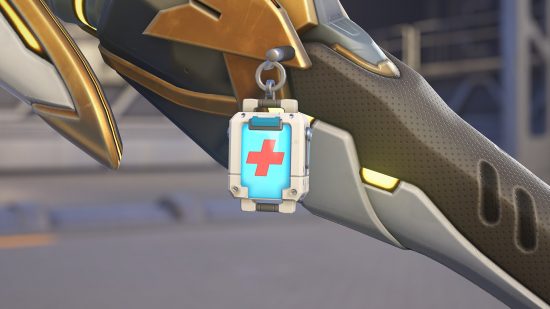 Overwatch 2 free Reaper skin double Xp weekend announcement: an image of the free Health Pack charm on Mercy's Caedecus Staff