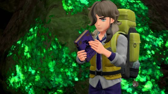 Pokemon Scarlet and Violet sales: A man wearing a large rucksack holds a purple book