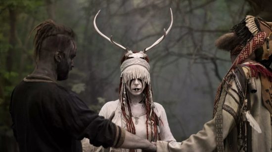 Alternative Music games: The three members of band Heilung, one of which is wearing a white stags skull in viking style