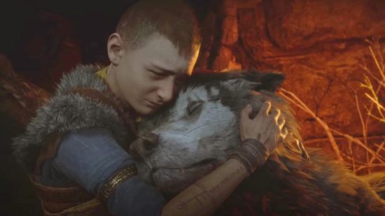 God of War Ragnarok: Atreus hugging the neck of pet wolf Fenrir