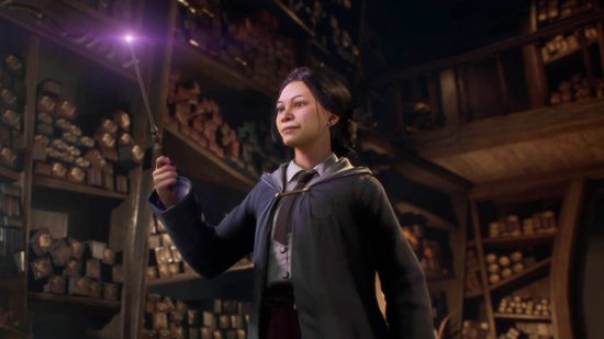 Hogwarts Legacy spells: The customisable main character inspecting their new wand.