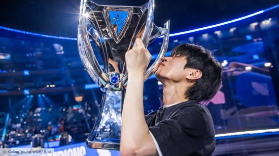 LoL Worlds 2023: A player from DRX lifts and kisses the Summoner's Cup trophy
