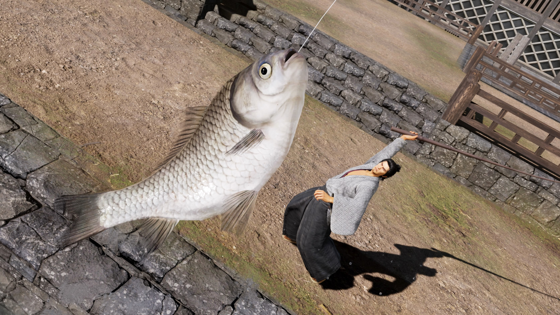 Like a Dragon Ishin review: Ryoma catches a fish in a fishing game