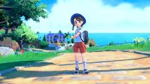 Pokemon scarlet and violet new pokemon: A trainer in a school uniform stands on a path with blue sky and see in the background