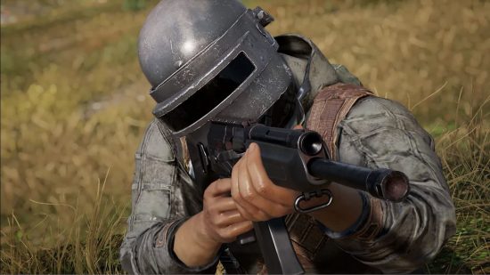 PUBG extraction shooter: A PUBG character wearing a full face helmet points an assault rifle