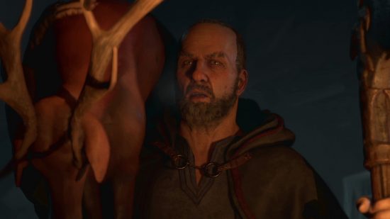 Diablo 4 Lorath Nahr voice actor: Lorath carrying a deer over his shoulder in the dark.
