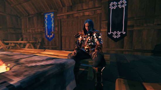 Valheim Iron: A person can be seen in a building