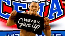 WWE 2K23 action figure John Cena roster: an image of the action figure variant holding a banner in-game