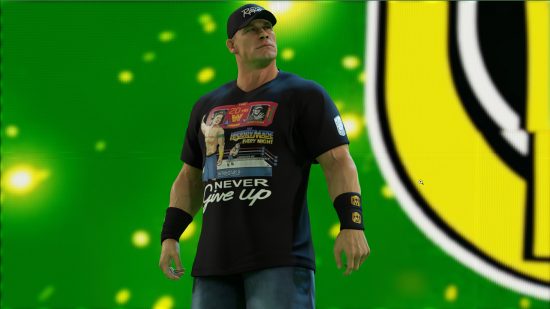 WWE 2K23 review: John Cena stands on the stage wearing a baseball cap and a t-shirt