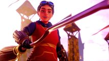 Harry Potter Quidditch Champions reveal Hogwarts Legacy missing feature: an image of a woman holding a broom with a smile