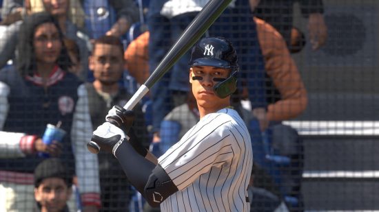 MLB The Show 23 review: A batter in a white baseball jersey raises their bat preparing for a swing