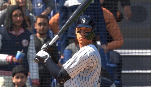 MLB The Show 23 review: A batter in a white baseball jersey raises their bat preparing for a swing