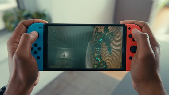 Nintendo Switch review image showing someone playing The Legend of Zelda: Tears of the Kingdom in handheld mode.