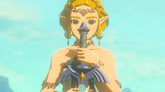 The Legend of Zelda Tears of the Kingdom Master Sword: Zelda holding the Master Sword, blade down, looking at it solemnly.