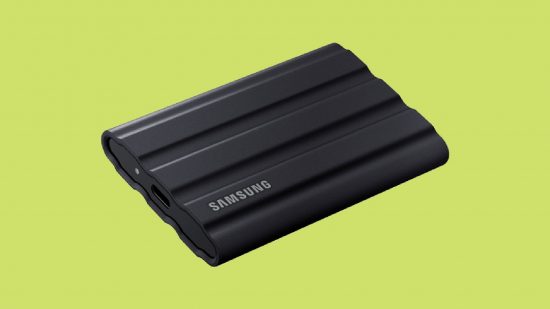 Best SSDs for PS5: Samsung T7 Shield Portable SSD in front of a green background