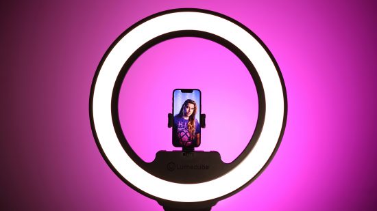 A streamer using the Lume Cube Cordless Ring Light Pro against a purple background