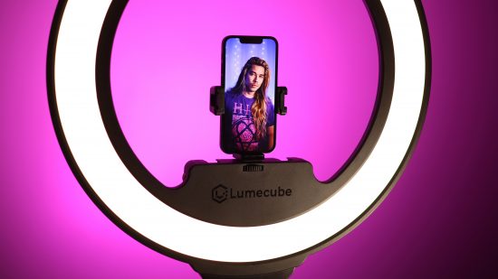 A streamer using the Lume Cube Cordless Ring Light Pro against a purple background