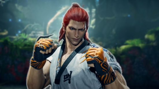 Tekken 8 closed network test: a fighter in a white robe, orange gloves, and with red hair, raises his fists in a fighting stance