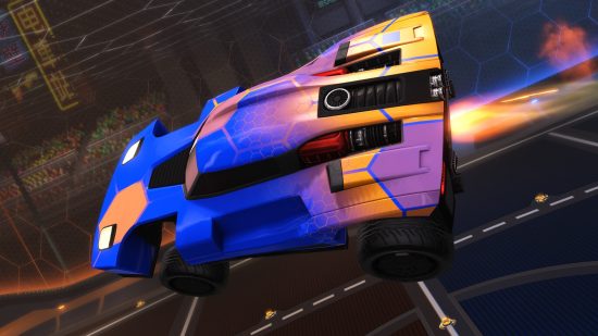 Rocket League ranks: A blue and orange car boosting through the air.