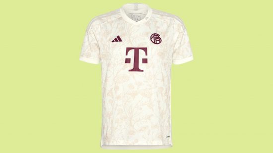 FC 24 best kits: A cream and burgundy football shirt on a green background