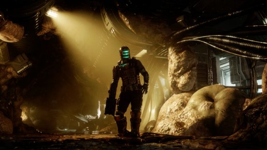 Best space games: An eerie, dimly-lit cave with a human in a spacesuit with a glowing blue helmet visor in Dead Space Remake.