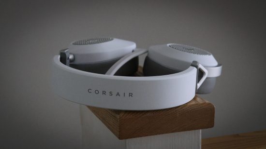 A Corsair HS65 headset on its side.