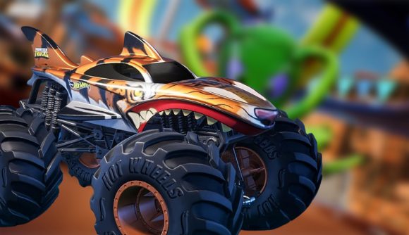 Hot Wheels Unleashed 2 game pass: Monster Truck from Hot Wheels Unleashed 2 in front of a racing track background
