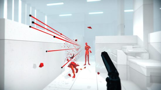 Best FPS games: A player holding a gun while dodging the bullets shot by an enemy in front of them in Superhot.