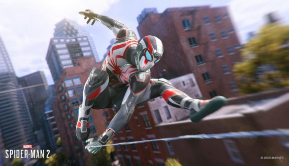 Spider-Man PS5 suits: Peter swinging through the streets wearing the Tactical Suit.