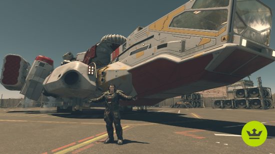 Starfield ship building: A player standing next to their custom-built ship with their arms out.