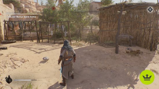 Assassin's Creed Mirage Left Behind Enigma: The player looking at the ground where the Left Behind drawing leads, with sand all around, two fish racks, and a straw hut to the right.