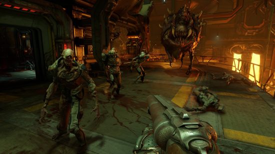 Best FPS games: The player aiming a shotgun towards a group of demons in an industrial environment in Doom (2016).