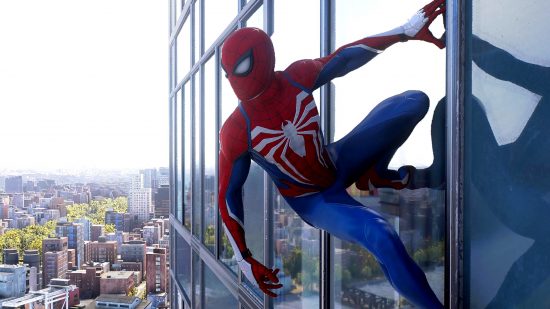 Best PS5 open world games: Peter Parker in Spider-Man suit hanging off the side of a skyscraper