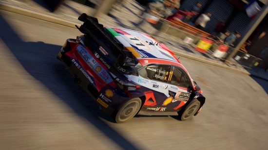 Best PS5 racing games: A black, white, and red rally car blasts through a dusty street