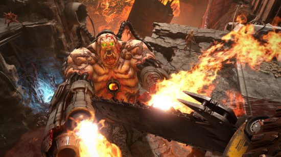 Best Xbox games: The player holding a chainsaw while leaping towards a large demon with flamethrower hands in Doom Eternal.