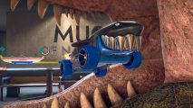 Hot Wheels Unleashed 2 review: A blue and black car that looks like a shark boosts through the open jaws of a dinosaur