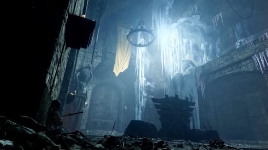 Destiny 2 Warlord's Ruin: A dark hall inside the castle, with a large wooden door at the back and ice creeping in.